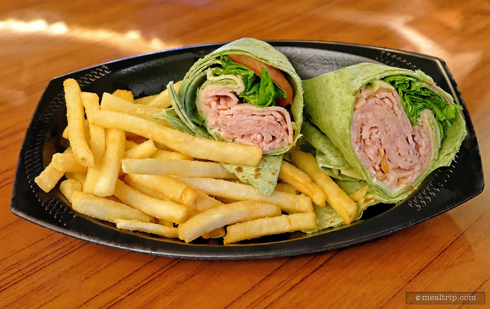 A Turkey Wrap With Fries From The Crown Colony House